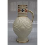 A Victorian pottery creamware jug with a cylindrical neck and bulbous body decorated with serpents