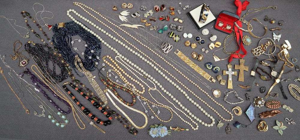 A collection of costume jewellery including faux pearls, beaded necklaces, clip on earrings, bangle,