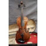 A Violin with two piece back and ebony stringing, overall 58.5cm long, back not including button 35.
