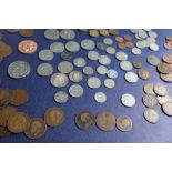 An Elizabeth II Five Pounds coin together with assorted crowns, half crowns, sixpences,