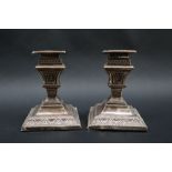 A pair of late Victorian silver desk candlesticks,