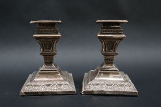 A pair of late Victorian silver desk candlesticks,