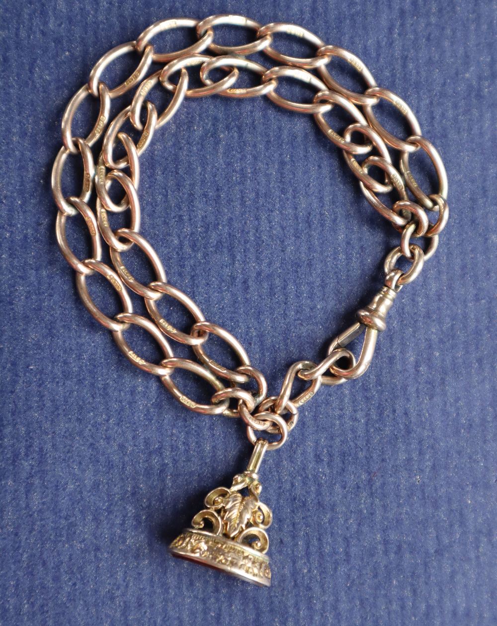A 9ct yellow gold bracelet made from an Albert chain with twisted oval links and a yellow metal - Image 2 of 4