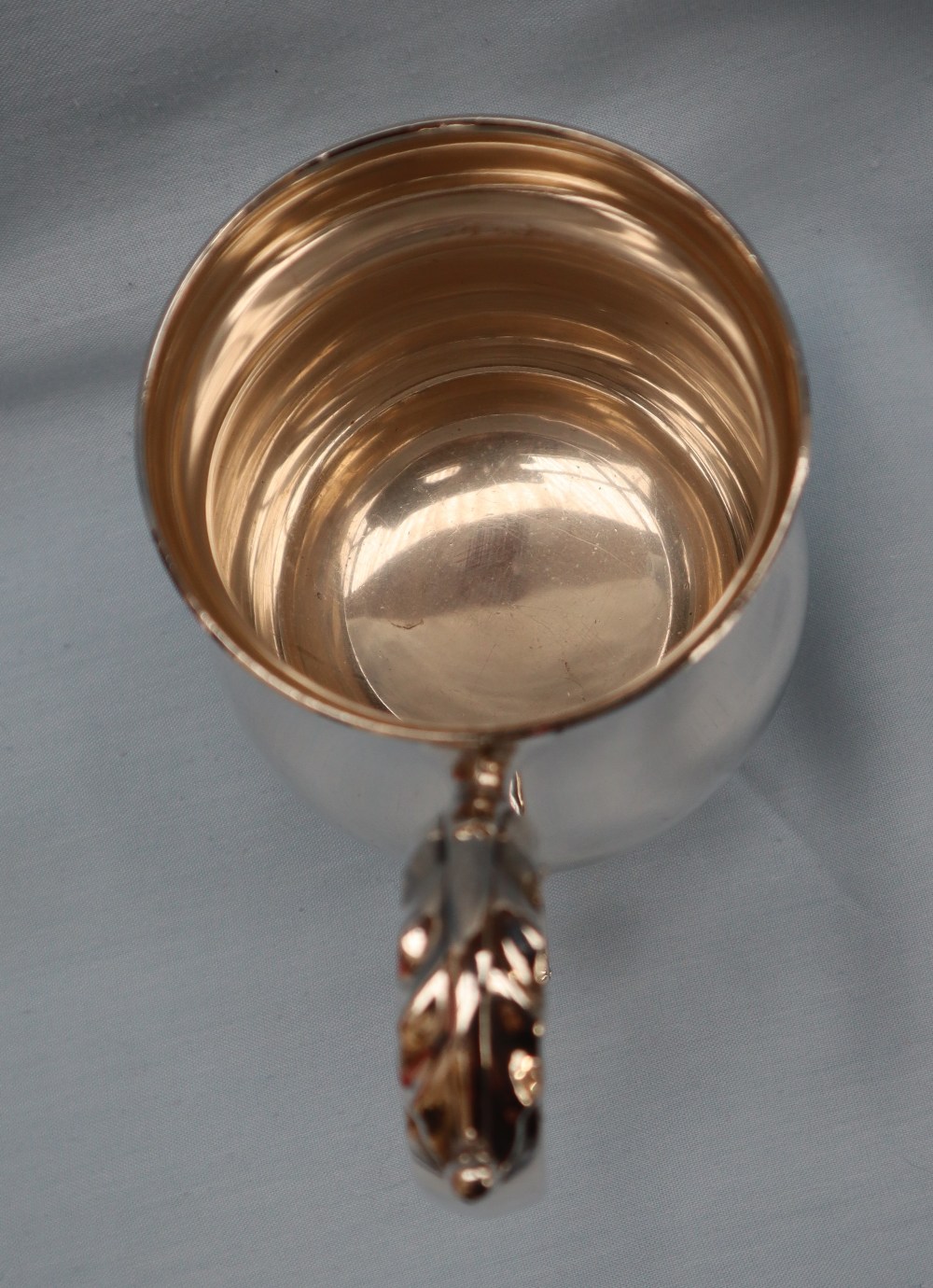 An Elizabeth II silver tankard of baluster form with a leaf capped scrolling handle on a spreading - Image 3 of 6