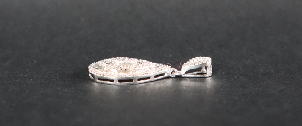 An 18ct white gold pendant set with approximately one hundred and seventy natural baguette, - Image 5 of 6