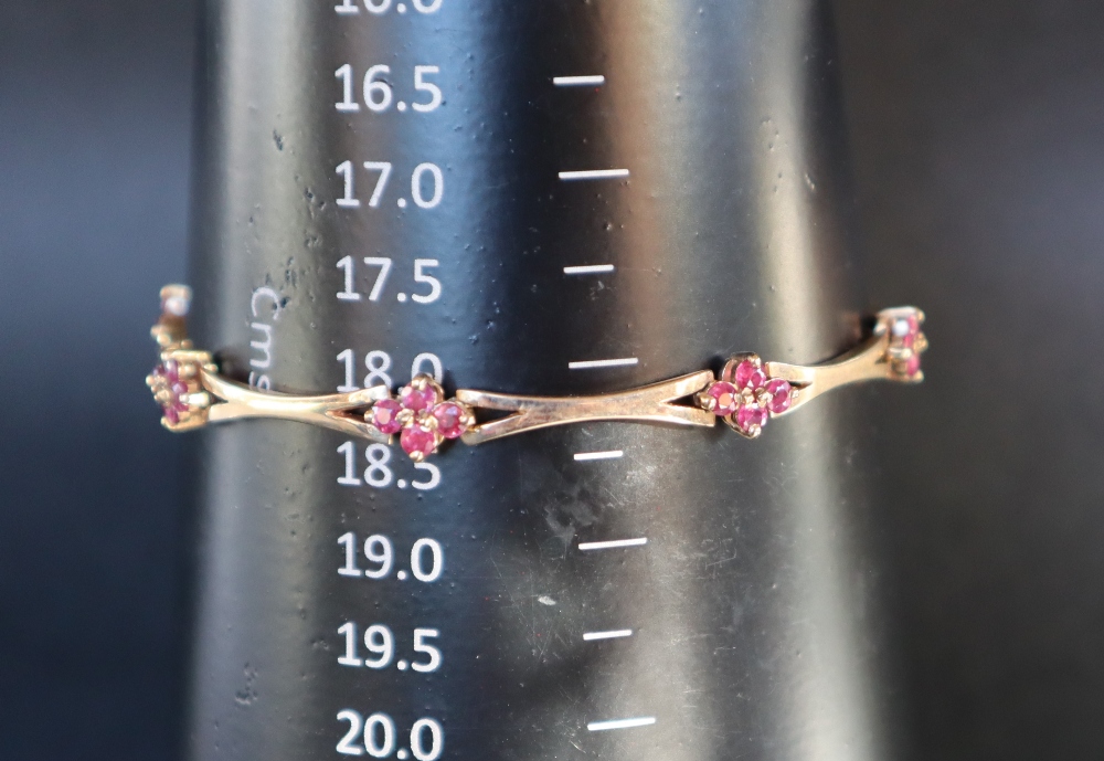 A 14ct yellow gold bracelet set with eight clusters of four rubies, 19cm long, - Image 3 of 4