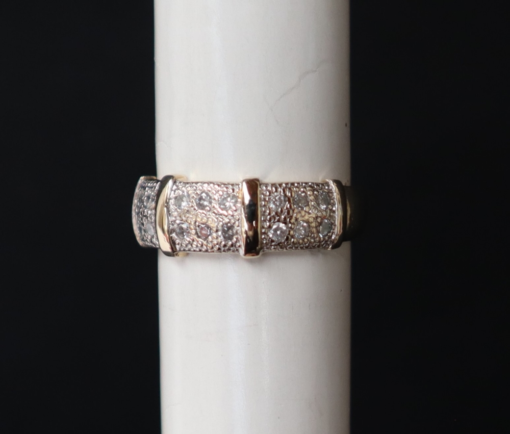 A 9ct gold diamond half hoop eternity ring, set with eighteen round brilliant cut diamonds, size M,