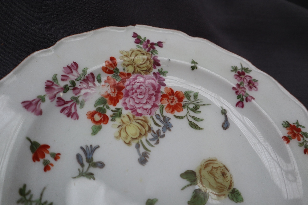 A porcelain plate with a shaped edge, painted with sprays of garden flowers, - Image 2 of 5