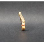 A yellow metal Caterpillar Club pin badge,