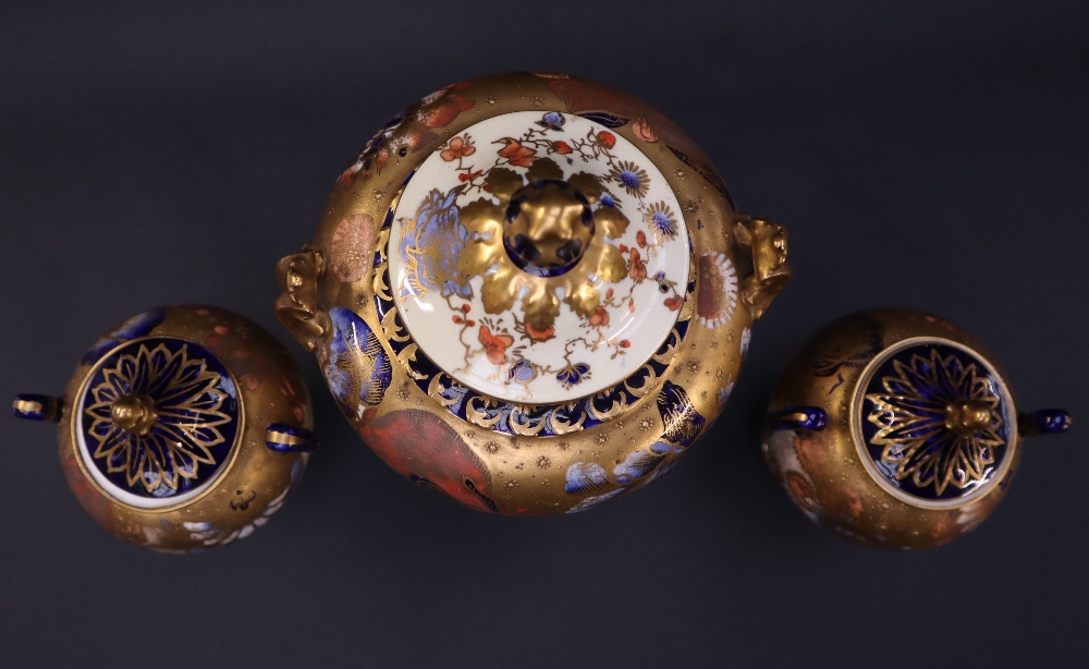 A Royal Crown Derby garniture of three vases with domed covers the body decorated with flower heads - Image 6 of 6