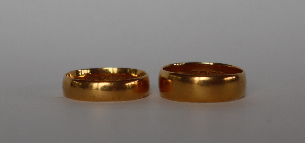 A 22ct yellow gold wedding band, size M, together with another size L, approximately 8. - Image 2 of 2