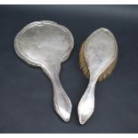 A George V silver backed hand mirror and matching brush, Birmingham, 1920,