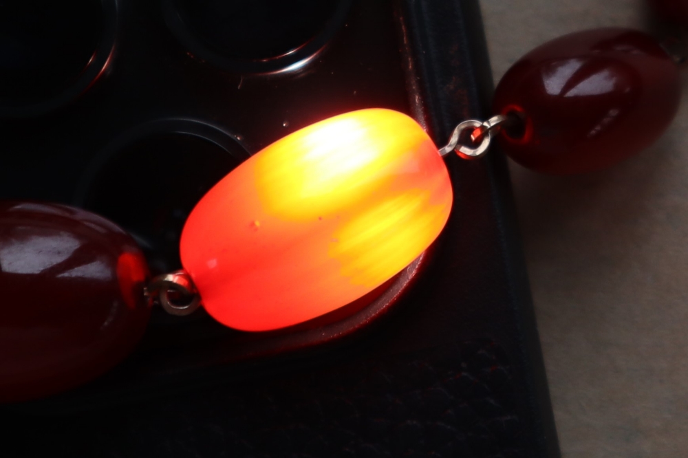 A string of cherry amber / bakelite beads, - Image 11 of 12