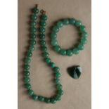 A green jade beaded necklace,