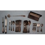 A continental white metal bead decorated part flatware service comprising nine table spoons,