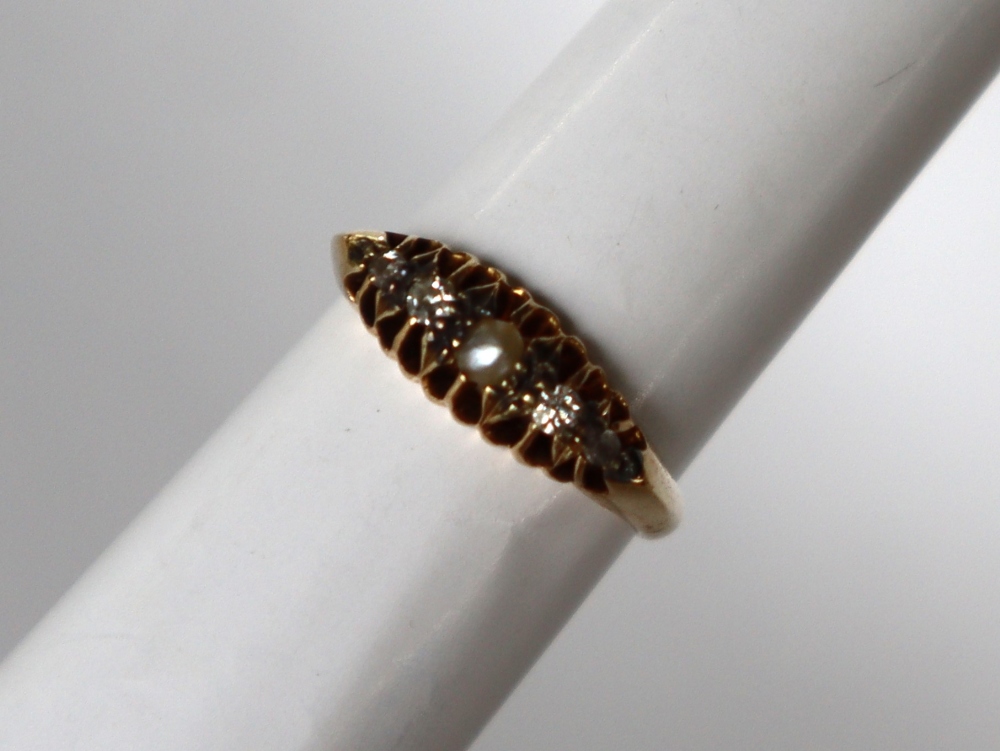 A diamond and pearl dress ring,