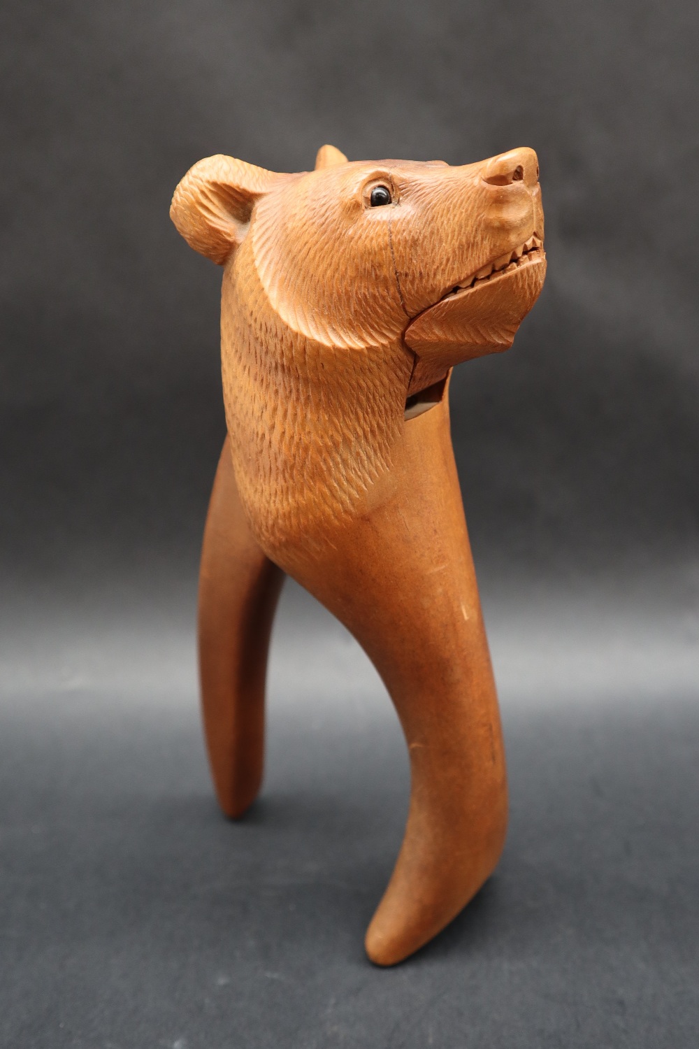A Black Forest carved Bear lever nut cracker together with two carved bear topped bottle stops, - Image 7 of 9