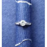 A solitaire diamond ring, the round brilliant cut diamond approximately 0.