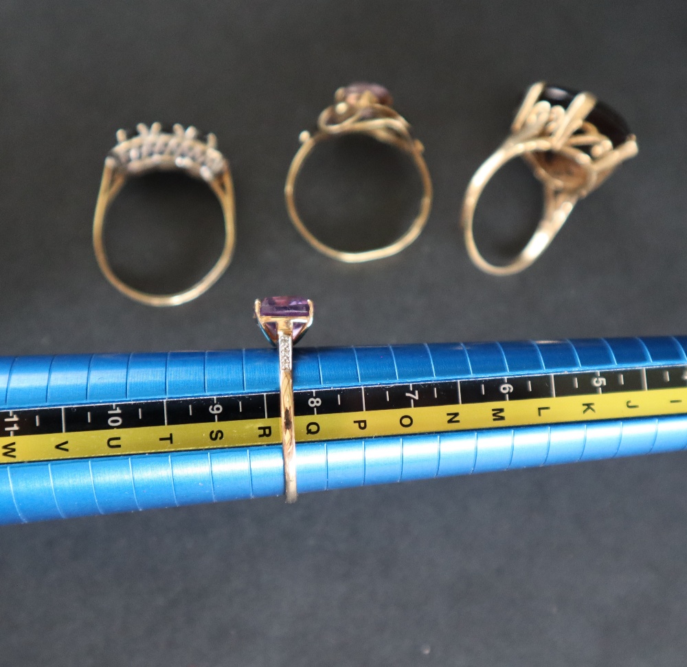 A 9ct yellow gold amethyst set dress ring together with two other 9ct gold rings another ring and - Image 7 of 8