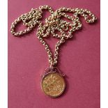 A George V gold sovereign dated 1914 in a 9ct gold slip mount on a 9ct gold chain,