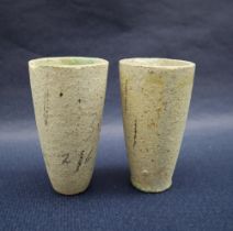 A pair of ancient Egyptian beakers of tapering cylindrical form, glazed to the interior, 10.