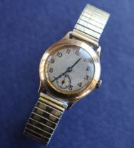 An Hefik Watch Co 9ct gold wristwatch with a gilt dial,
