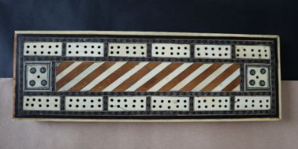 A 19th century bone and metal inlaid Cribbage board of rectangular form,