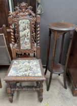 A 19th century oak dining chair with carved lion cresting with barley twist columns with a pad back