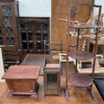 A sarcophagus shaped jewellery casket together with a pipe / smoking cabinet and a folding cake