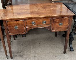 A 19th century mahogany desk with a rectangular top above three drawers on square tapering legs