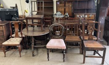 A gateleg dining table with an oval top on turned legs together with a matched set of four 19th