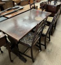 A 20th century oak refectory table together with a set of four ladder back dining chairs