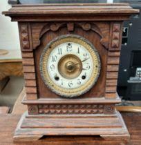 An Ansonia Clock Co Syria eight day mantle clock with a circular dial with Arabic numerals on