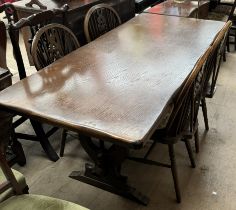 A 20th century oak rectory table together with a set of four wheelback dining chairs and a dresser