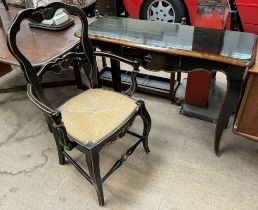 An ebonised console table with a single drawer on square tapering legs together with a matching