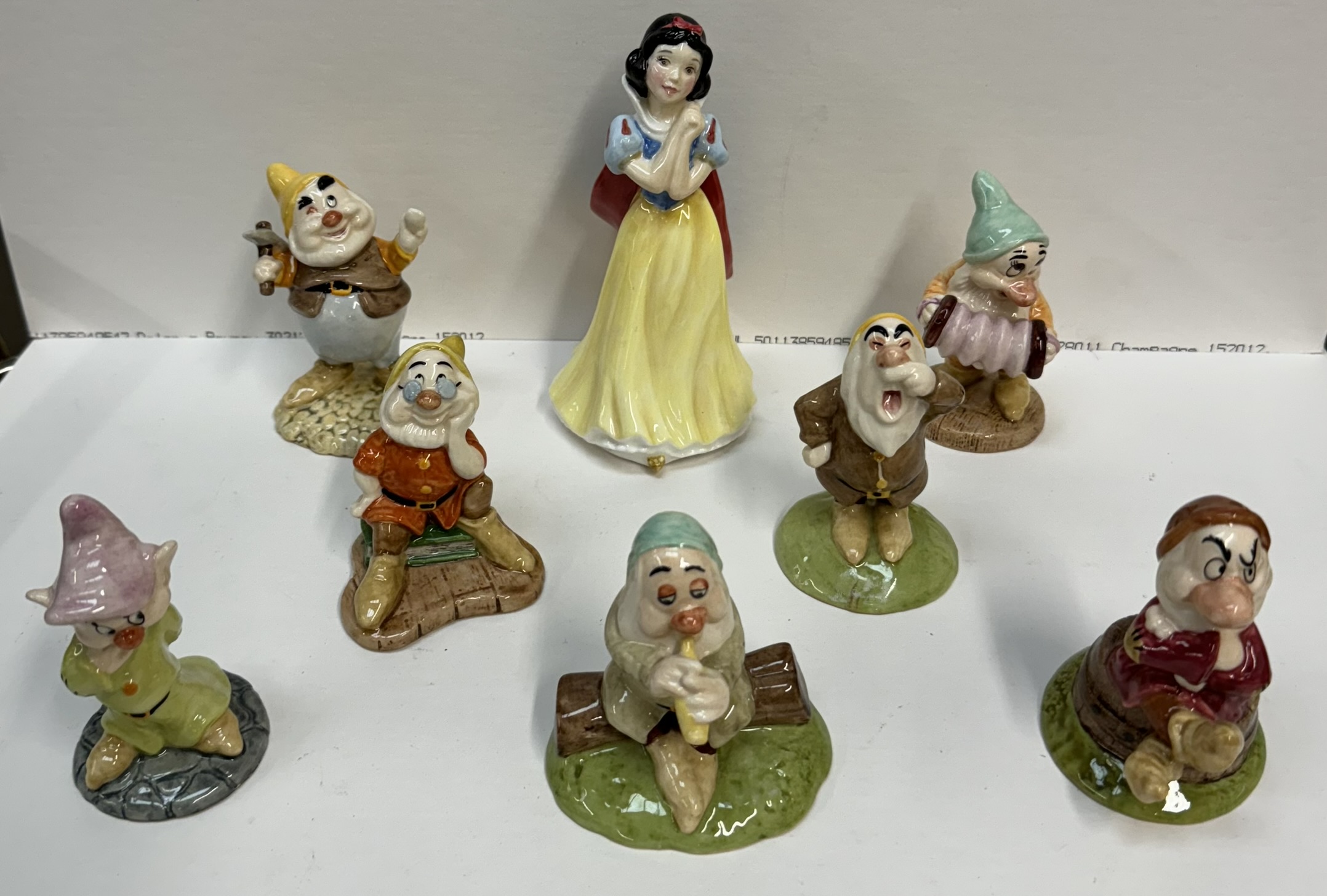 Royal Doulton figure of Snow White SW9, together with Doc SW10, Grumpy SW11, Happy SW12, Dopey SW13,