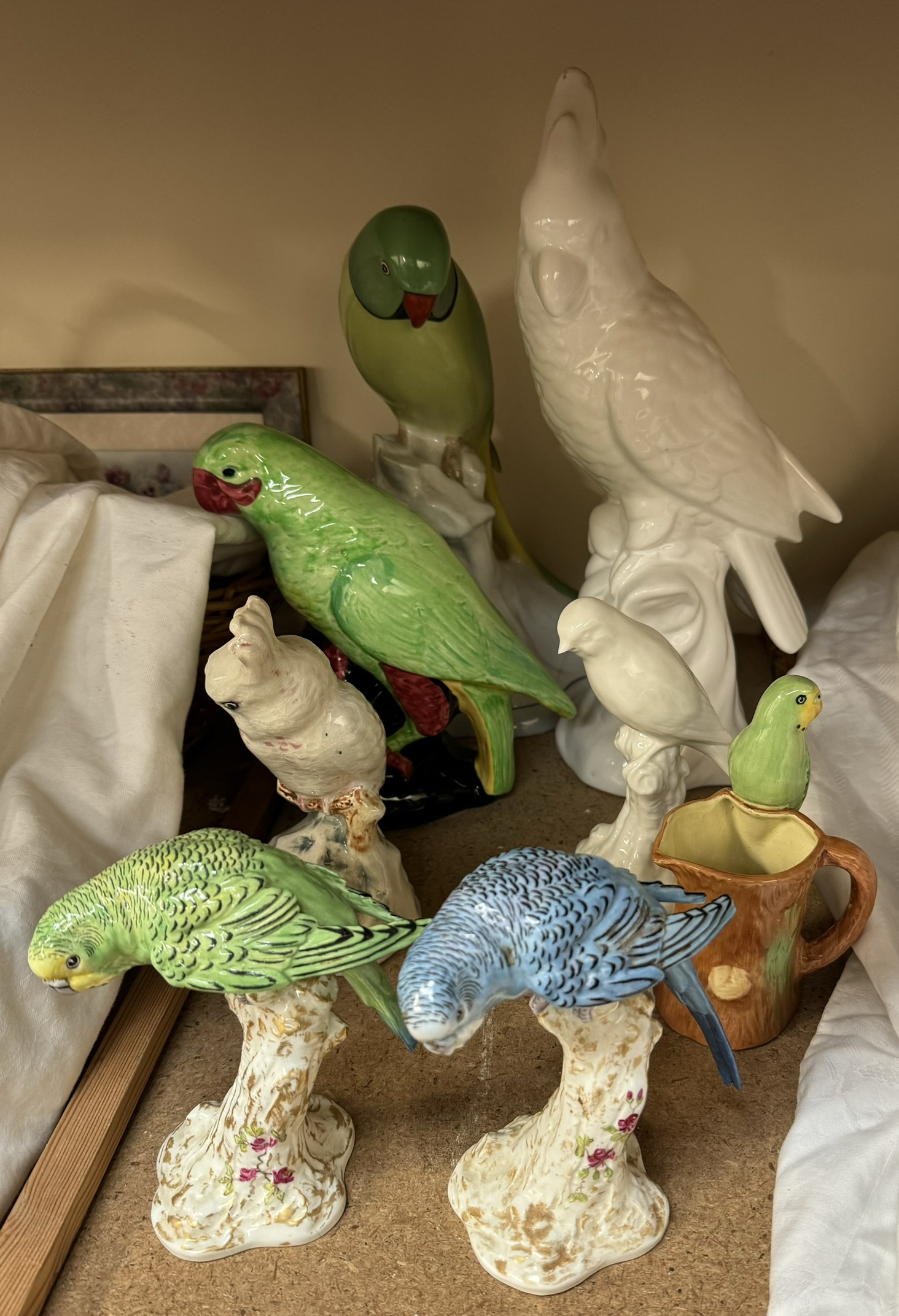 A pair of Royal Worcester budgerigars 2664 together with other large model birds