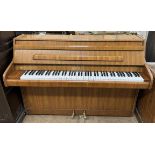 A walnut cased Bentley upright piano, metal framed overstrung, No.