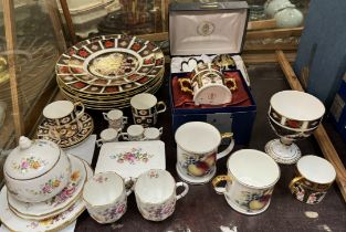 A collection of Royal Crown Derby 1128 pattern plates together with similar mugs,