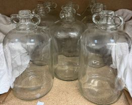 Eight assorted glass demi-johns