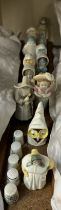 A collection of Royal Worcester candle snuffers including French Cook, Owl, Nun, Feathered Hat,