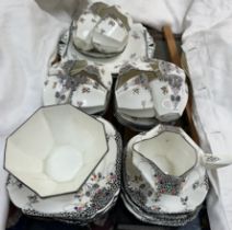 A Shelley porcelain black leaf pattern part tea service number 11575, comprising twelve tea cups,