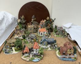 A collection of Danbury Mint cottages together with bird models etc