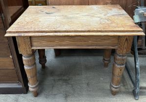 A pine side table on turned legs