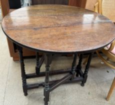 A small oak gateleg table on turned legs