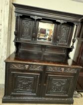A 19th century Low Countries carved oak mirrorback sideboard,