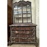 A 19th century Dutch marquetry decorated walnut bookcase with a moulded cornice above a pair of