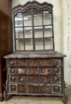 A 19th century Dutch marquetry decorated walnut bookcase with a moulded cornice above a pair of