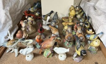 A collection of Royal Worcester model birds together with other model birds etc