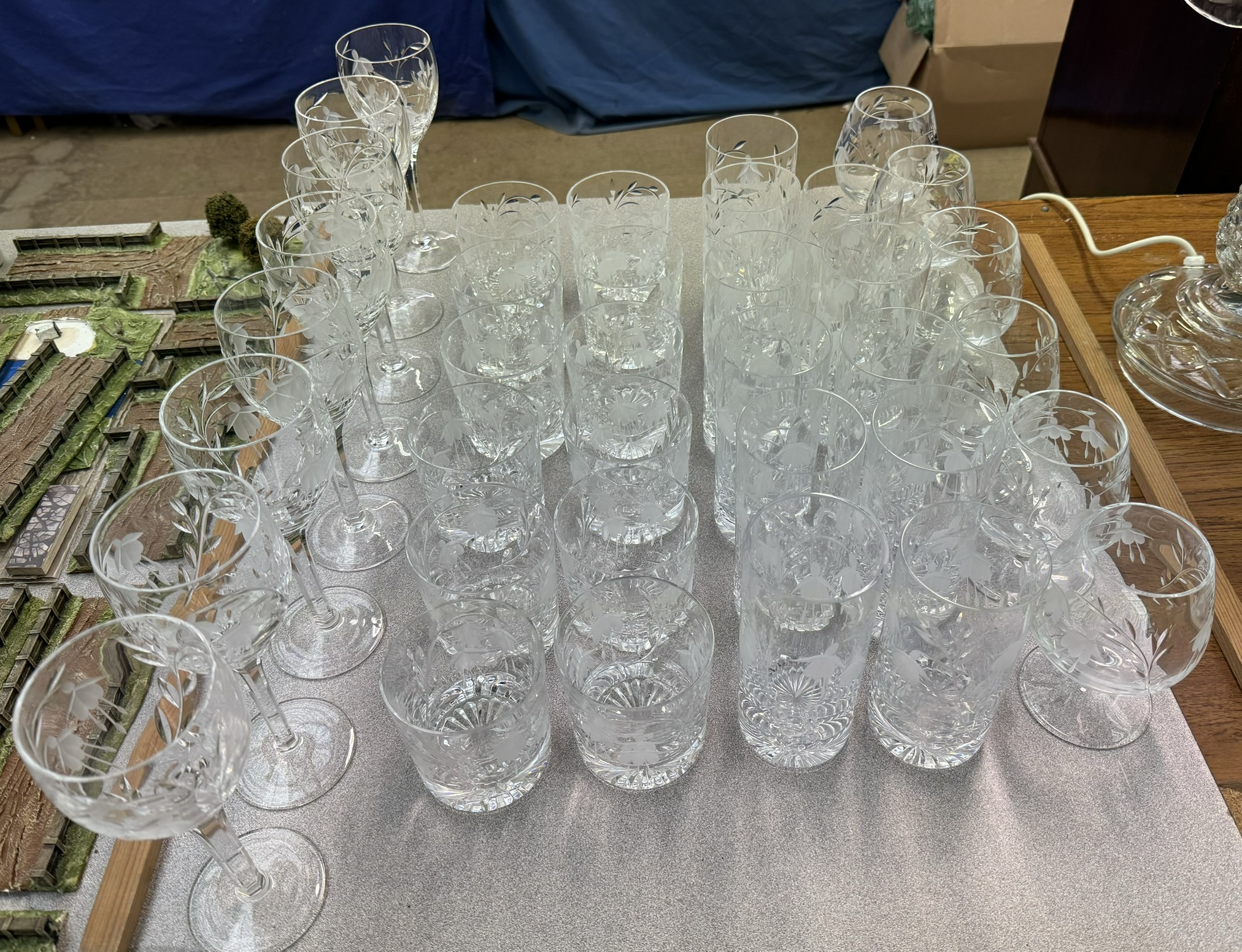 A collection of Stuart crystal drinking glasses including wine glasses, tumblers,